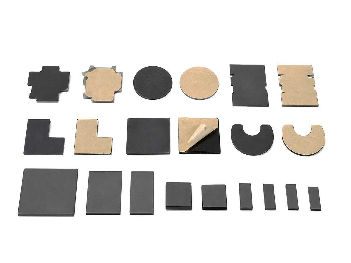 Die-cut EMI absorber pieces and ferrite tiles with adhesive backing